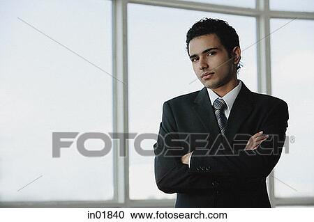 Young businessman arms crossed View Large Photo Image Stock Image - Young businessman arms crossed. Fotosearch
