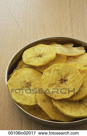 A bowl of banana chips View Large Photo Image Stock Photo - A bowl of banana chips. Fotosearch