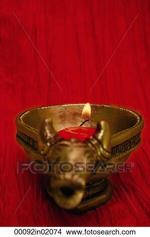 A golden ox candle holder and candle View Large Photo Image Picture - A golden ox candle holder and candle. Fotosearch