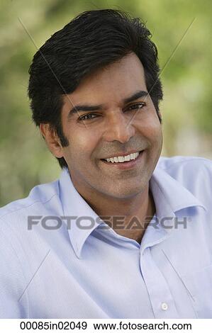 A man smiles at the camera View Large Photo Image Stock Photo - A man smiles at the camera. Fotosearch