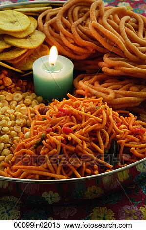 A mixed snack platter with a candle View Large Photo Image Stock Photography - A mixed snack platter with a candle. Fotosearch