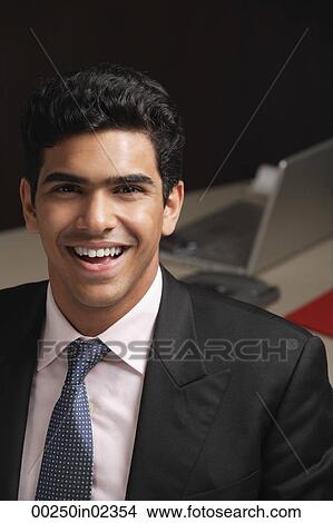 Businessman smiling at camera View Large Photo Image Picture - Businessman smiling at camera. Fotosearch