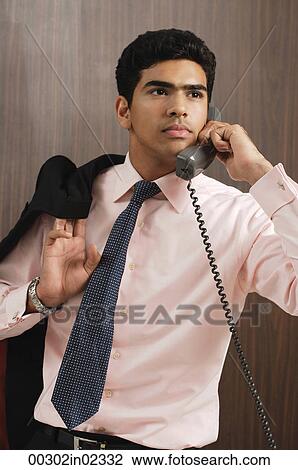 Businessman talking on the phone View Large Photo Image Stock Image - Businessman talking on the phone. Fotosearch