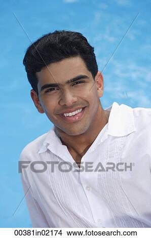 Man by the pool, smiling at camera View Large Photo Image Picture - Man by the pool, smiling at camera. Fotosearch