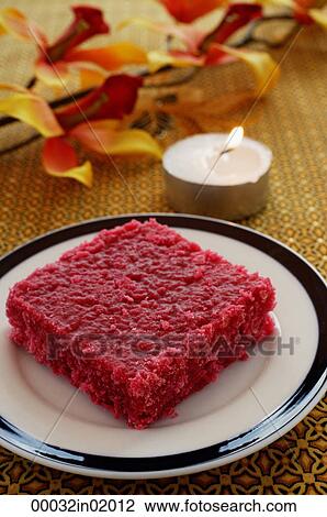 Red burfi with a candle View Large Photo Image Stock Image - Red burfi with a candle. Fotosearch