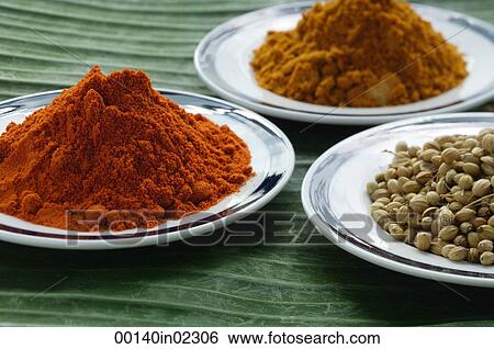 Stock Photograph - Still life of curry and masala powder on a banana leaf. Fotosearch