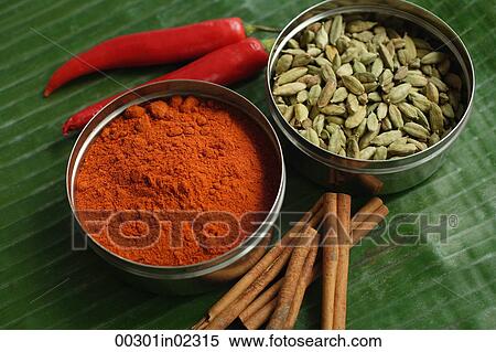 Still life of masala powder, seeds, cinnamon sticks and red chillies View Large Photo Image Stock Photography - Still life of masala powder, seeds, cinnamon sticks and red chillies. Fotosearch