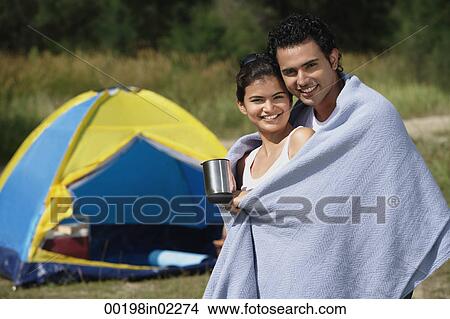 Picture - Young couple camping in the wilderness. Fotosearch