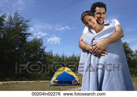 Young couple camping in the wilderness View Large Photo Image Stock Photograph - Young couple camping in the wilderness. Fotosearch