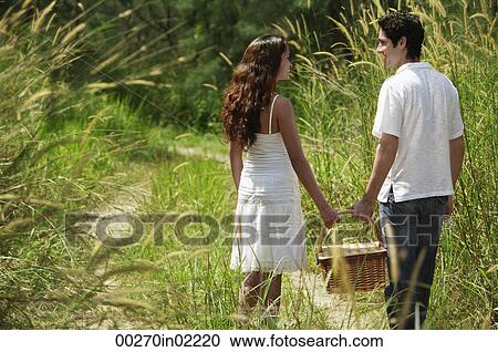 Young couple going for a picnic View Large Photo Image Stock Image - Young couple going for a picnic. Fotosearch
