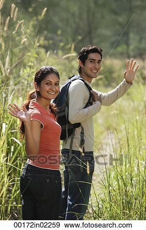 Young couple hiking in the wilderness View Large Photo Image Stock Photo - Young couple hiking in the wilderness. Fotosearch
