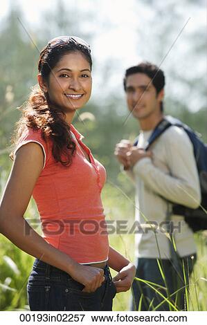 Young couple hiking in the wilderness View Large Photo Image Stock Photo - Young couple hiking in the wilderness. Fotosearch
