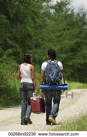 Stock Photo - Young couple hiking in the wilderness. Fotosearch