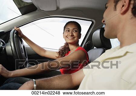 Young couple in car View Large Photo Image Stock Photo - Young couple in car. Fotosearch