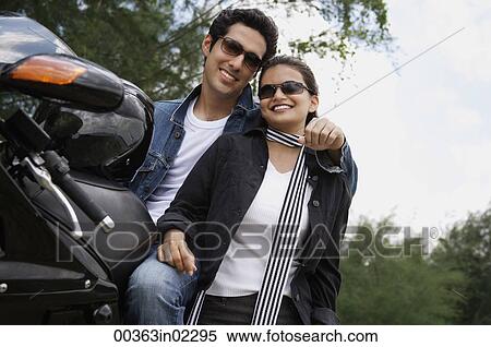 Young couple with motorbike View Large Photo Image Stock Photography - Young couple with motorbike. Fotosearch