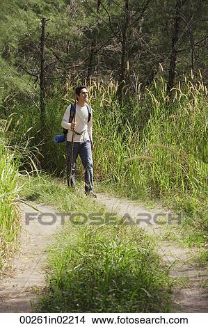 Young man hiking in the wilderness View Large Photo Image Picture - Young man hiking in the wilderness. Fotosearch
