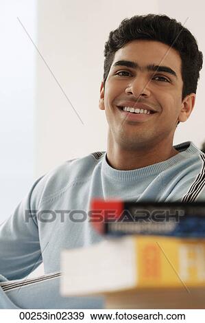 Young man smiling at camera View Large Photo Image Stock Photo - Young man smiling at camera. Fotosearch