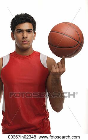 Young man with basketball looking at camera View Large Photo Image Stock Photo - Young man with basketball looking at camera. Fotosearch