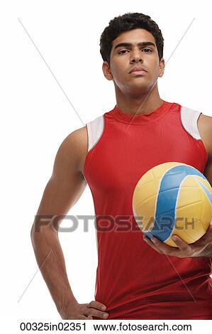 Young man with beach ball looking at camera View Large Photo Image Stock Image - Young man with beach ball looking at camera. Fotosearch