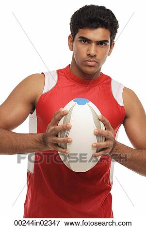 Young man with rugby looking at camera View Large Photo Image Stock Photo - Young man with rugby looking at camera. Fotosearch