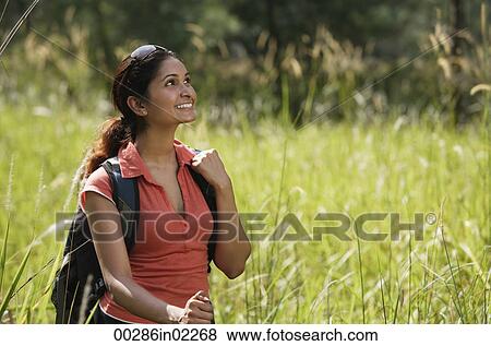 Young woman hiking in the wilderness View Large Photo Image Stock Photo - Young woman hiking in the wilderness. Fotosearch