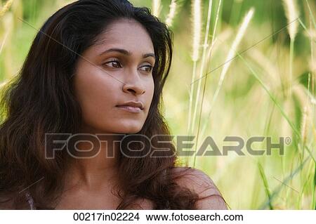 Young woman looking into distance View Large Photo Image Picture - Young woman looking into distance. Fotosearch