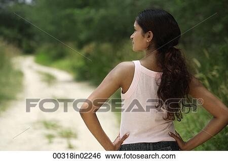 Young woman looking into distance View Large Photo Image Stock Photograph - Young woman looking into distance. Fotosearch