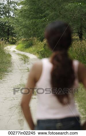Young woman looking into distance View Large Photo Image Stock Photography - Young woman looking into distance. Fotosearch
