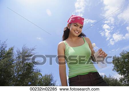 Stock Photography - Young woman with bandana smiling at camera. Fotosearch