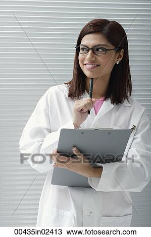 Doctor or scientist with report View Large Photo Image Stock Image - Doctor or scientist with report. Fotosearch