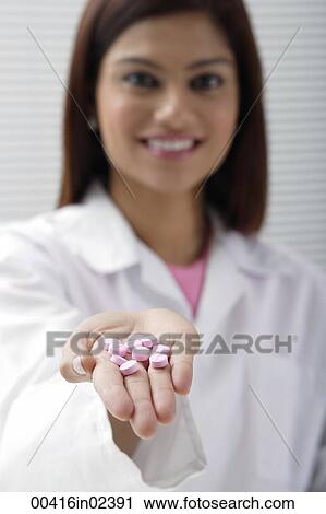 Doctor with open hand of pills View Large Photo Image Stock Image - Doctor with open hand of pills. Fotosearch