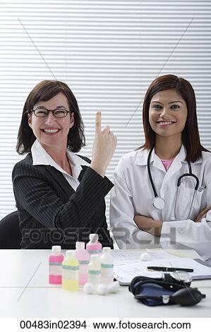Doctor with smiling patient View Large Photo Image Picture - Doctor with smiling patient. Fotosearch
