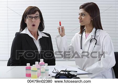 Frightened patient with doctor View Large Photo Image Stock Image - Frightened patient with doctor. Fotosearch