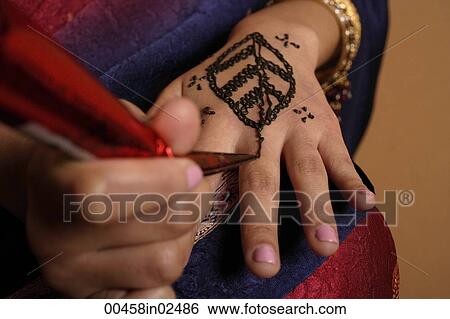 hands of Indian woman applying henna View Large Photo Image Stock Photograph - hands of Indian woman applying henna. Fotosearch