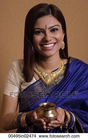 Indian woman holding offering View Large Photo Image Picture - Indian woman holding offering. Fotosearch