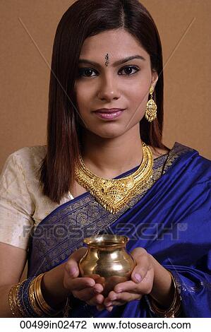 Indian woman holding offering View Large Photo Image Stock Image - Indian woman holding offering. Fotosearch