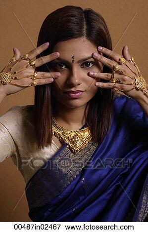 Stock Photo - Indian woman wearing traditional wedding jewelry. Fotosearch