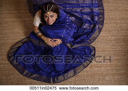 Stock Photography - Indian woman wearing traditional wedding jewelry. Fotosearch