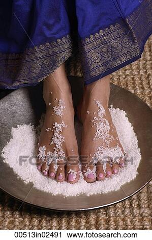 Indian woman with feet in salt scrub View Large Photo Image Stock Image - Indian woman with feet in salt scrub. Fotosearch