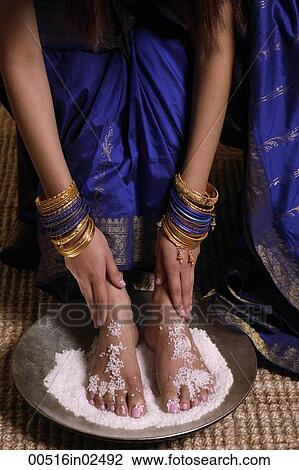 Indian woman with feet in salt scrub View Large Photo Image Stock Image - Indian woman with feet in salt scrub. Fotosearch
