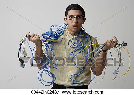 Man with cords and wires around his neck View Large Photo Image Stock Photo - Man with cords and wires around his neck. Fotosearch