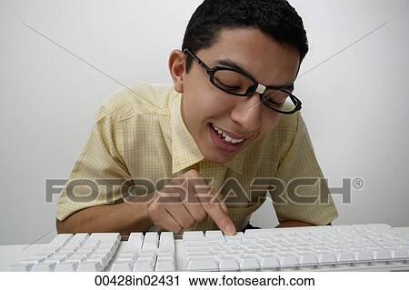 Nerd typing on keyboard View Large Photo Image Stock Image - Nerd typing on keyboard. Fotosearch