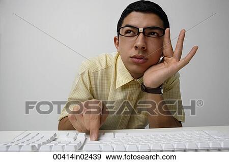 nerd working on keyboard View Large Photo Image Stock Photo - nerd working on keyboard. Fotosearch