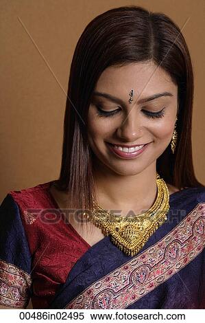 Stock Photography - Portrait of Indian woman wearing sari. Fotosearch