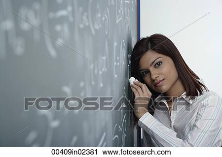 Tired teacher at chalk board View Large Photo Image Stock Image - Tired teacher at chalk board. Fotosearch