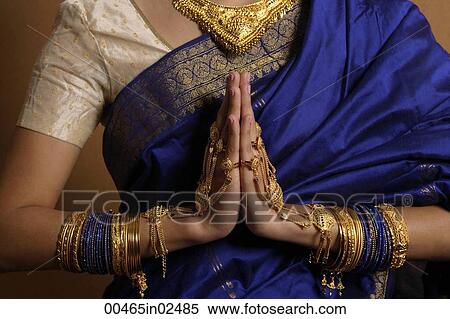 Stock Photography - Torso of Indian woman wearing sari and jewelry. Fotosearch