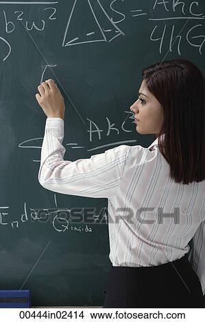 Woman at chalk board View Large Photo Image Picture - Woman at chalk board. Fotosearch