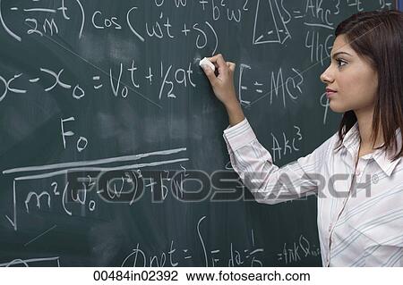 Woman working on equations on chalk board View Large Photo Image Stock Image - Woman working on equations on chalk board. Fotosearch