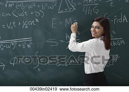 Stock Photo - Woman writing equations on chalk board. Fotosearch