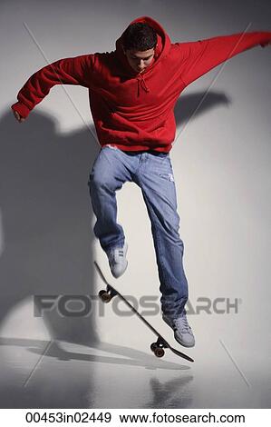 young man wearing red hooded sweatshirt on skateboard View Large Photo Image Stock Photo - young man wearing red hooded sweatshirt on skateboard. Fotosearch